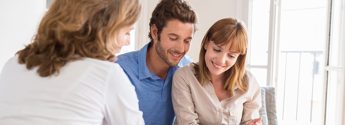 couple happily looking at documents