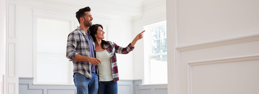 couple admiring interior of new home