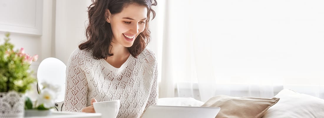 woman smiling with coffee